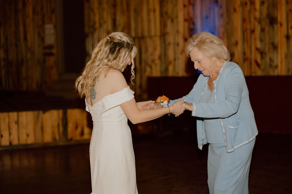 Bride and grandmother dancing