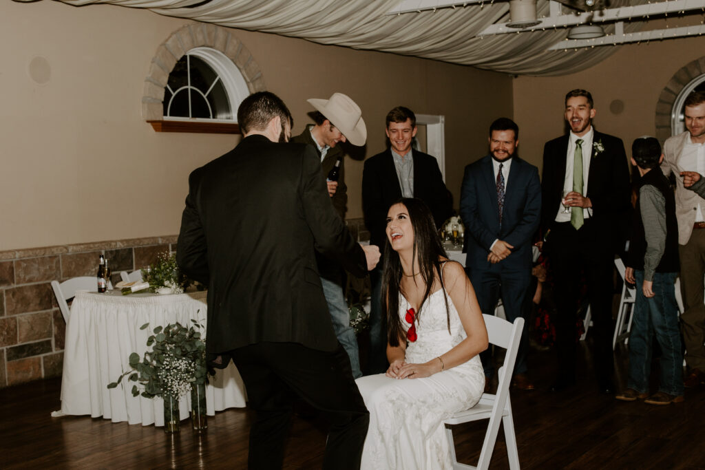 bride and groom playing wedding reception games